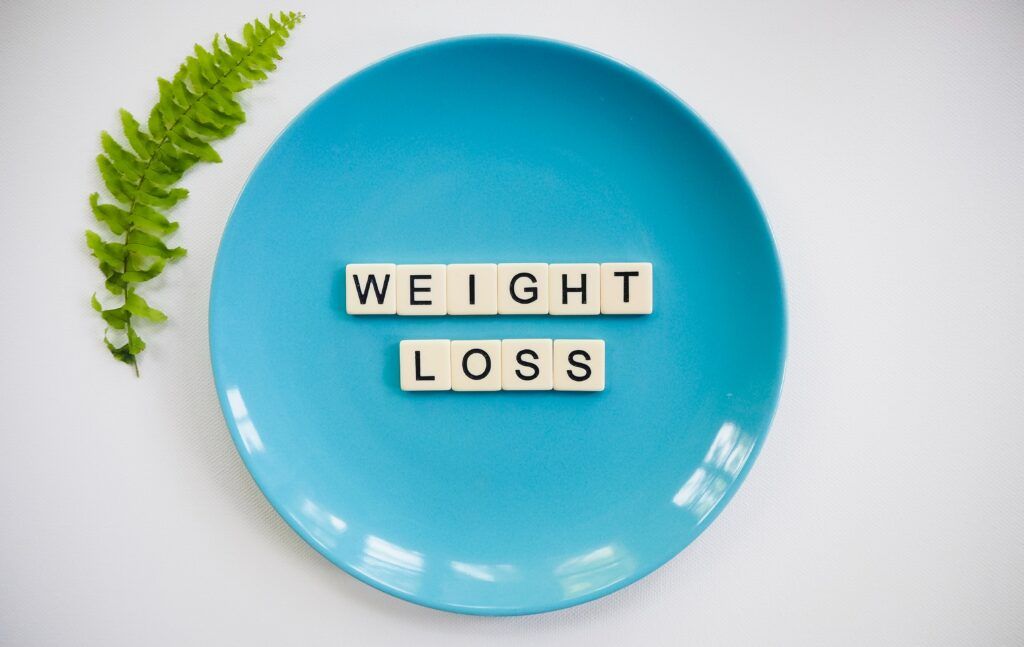  How to Run for Weight Loss a plate with weight loss written on