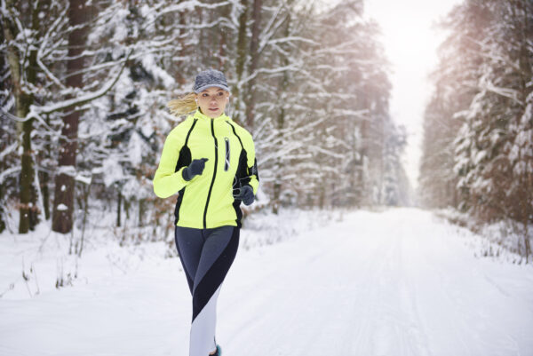 Runner training outdoors in cold winter conditions