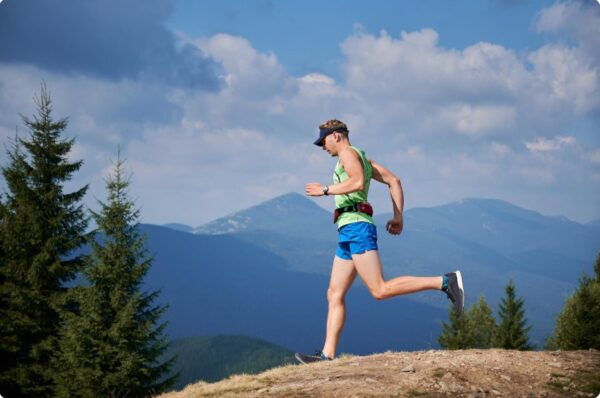 Runner on scenic trail representing personal growth through outdoor running