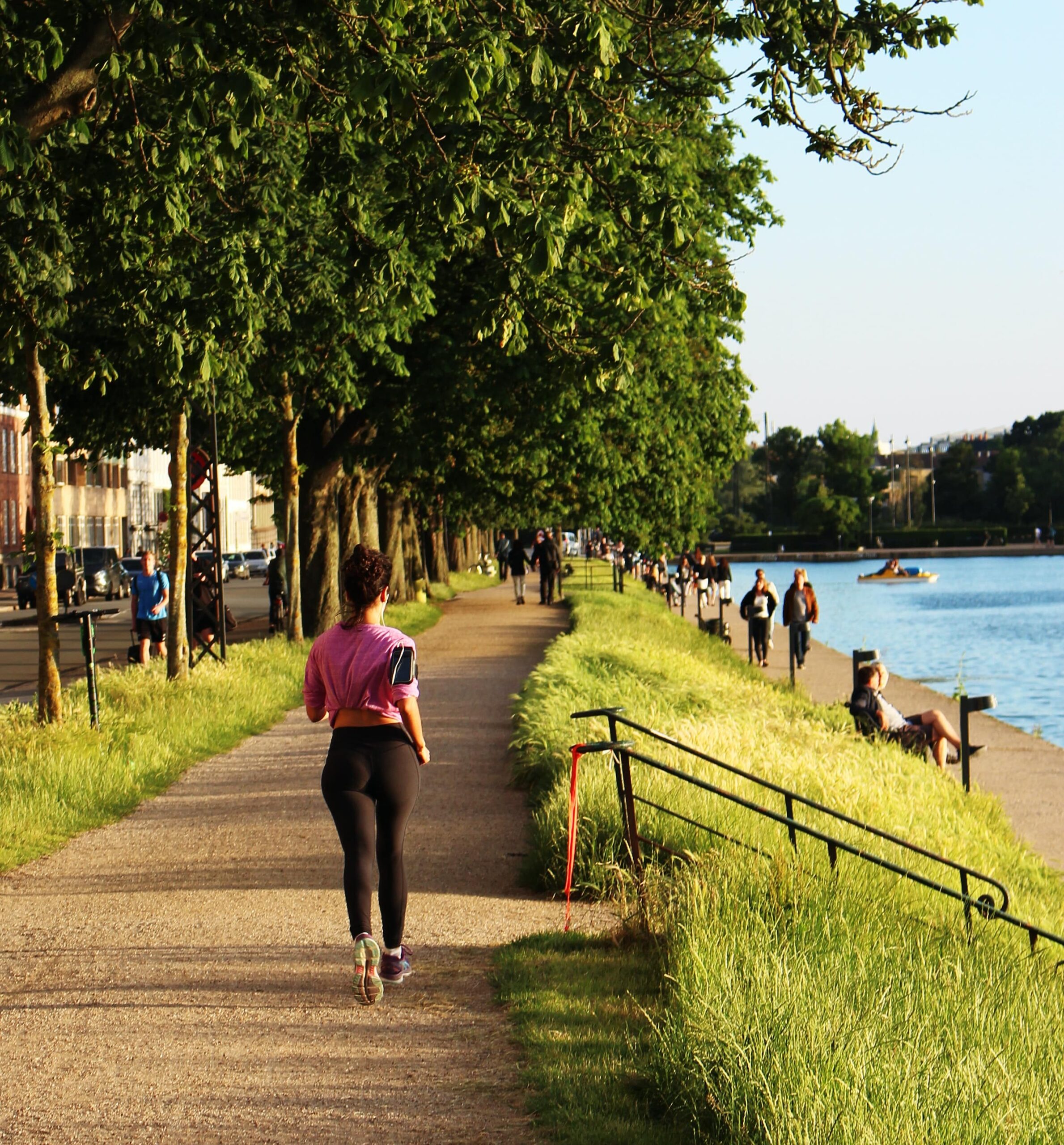 finish a marathon Woman runnig endurance training along a city lake