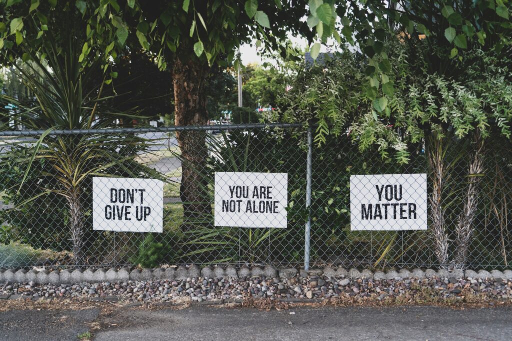 5-Best-informative-ways-to-recover-post-marathon-3-signs-hung-on-fences