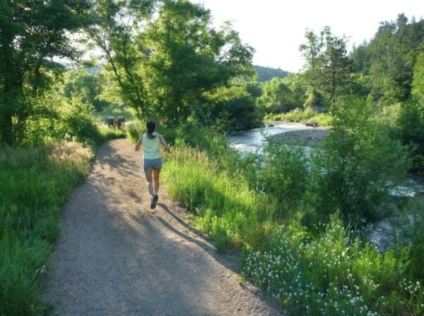Borg scale - woman trail runs in beautiful landscape