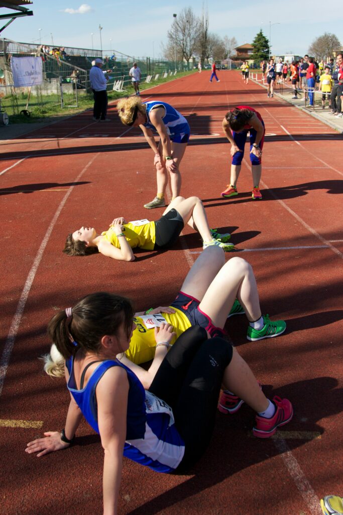 10-Informative-Training-tips - Makes-Breakthrough-In-A-Marathon-exhausted-female-runners-lies-down