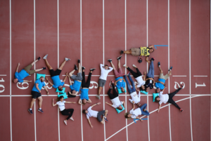 10-Informative-Training-Tips - Makes-Breakthrough-In-a-Marathon-runners-lies-down-on-the-running-track