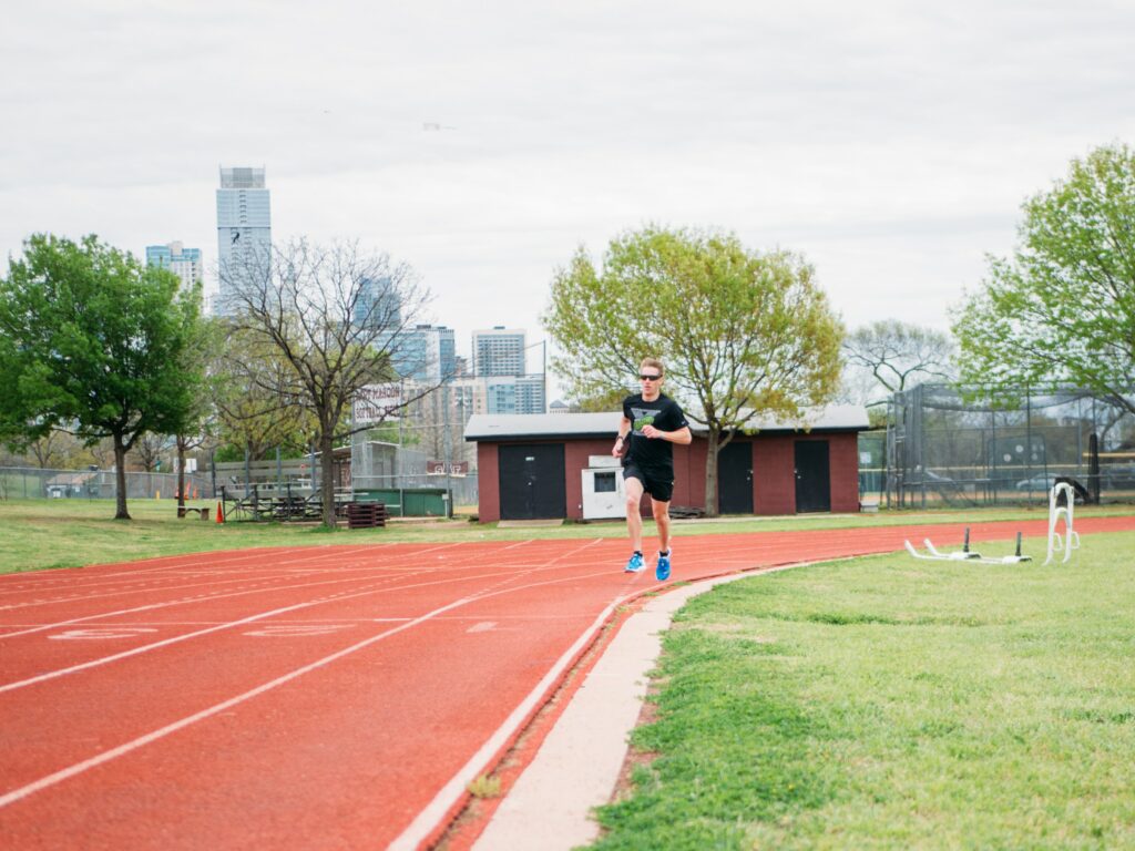 10-Informative-Training-Tips - Makes-Breakthrough-In-A-Marathon-man-running-alone-on-a-stadium