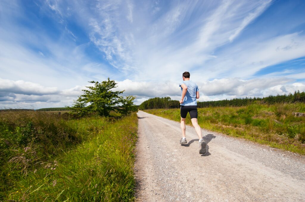 10-Informative-Training-tips - makes-Breakthrough-In-A-Marathon-man-running-in-the-open-air-on-a-gravel-path