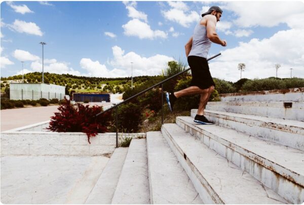 Marathon Training Schedule - A man runs up stairs as LT training.
