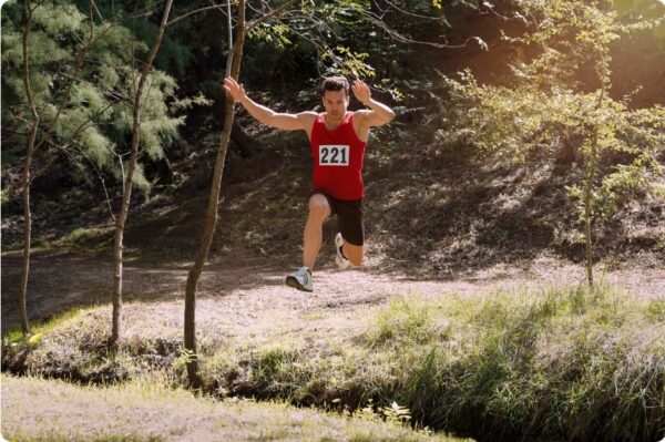 Marathon Training Schedule -runner perform fartlek in forrest.