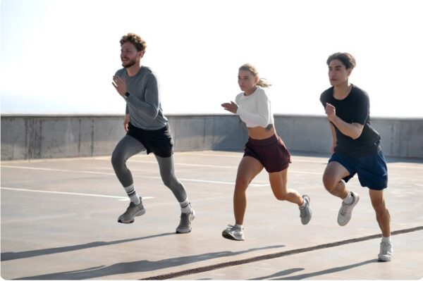 Marathon Training Schedule - running group performs interval training outdoors