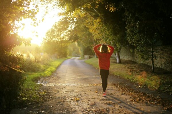 Recover post marathon - woman in the early morning sunrise ready for a recovery run.