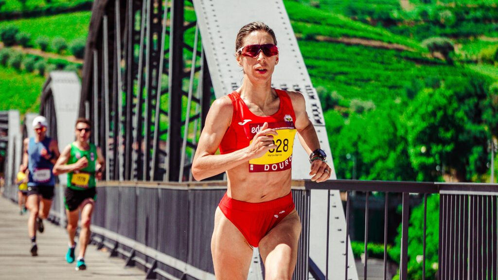 Marathon-Training-For-Elite-Run-2-Woman-in-a-Marathon-race-crossing-a-bridge