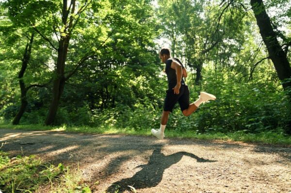 marathon training for outstanding results - A runner training fartlek on a forrest trail
