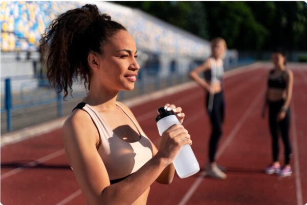 marathon training progress - runner holding a bottle of electrolyte water