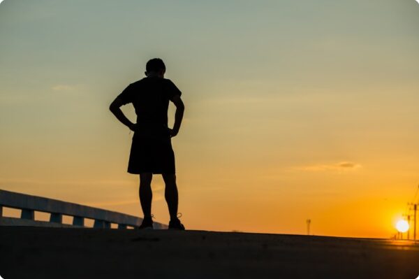 running for beginners - young fitness man running on sunrise