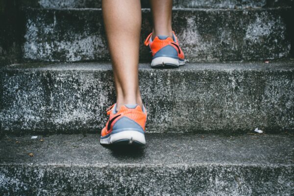 How To Make Progress By Running With Supercompensation woman on stair