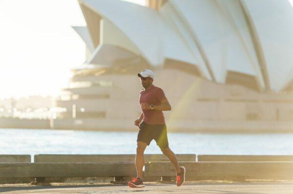 Train for a Marathon Man running with opera house as background