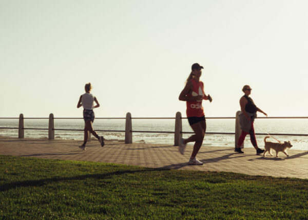  Health Benefits of Running girl along-ocean