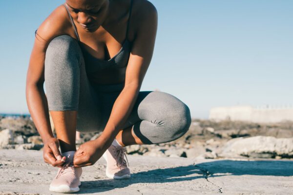 5 best ways to targeting and focus your running training woman ties shoelaces