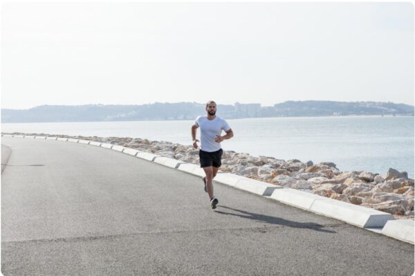 Runner following a training goal along the coast