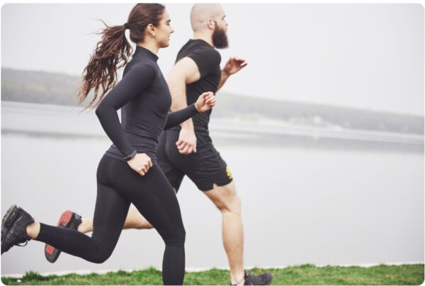 Two runners doing interval training outdoors