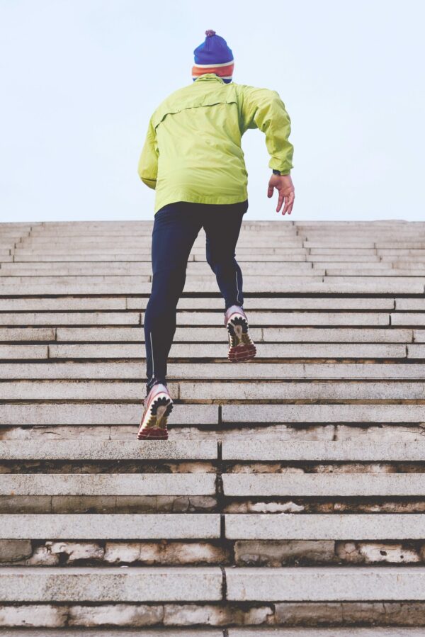 How To Run For Better Fitness Man running on stairs