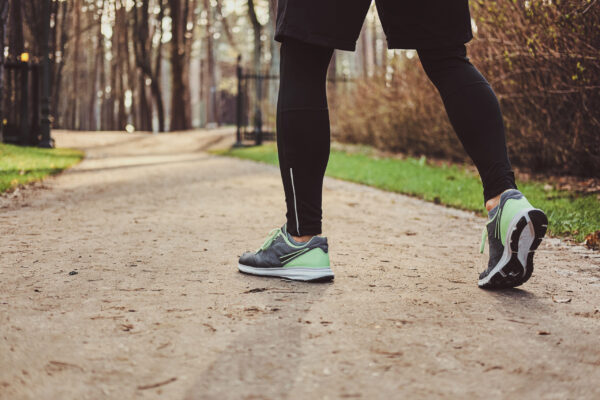 Running shoes on a park trail