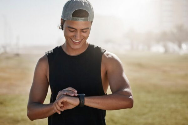 Runner checking a sports watch during a workout