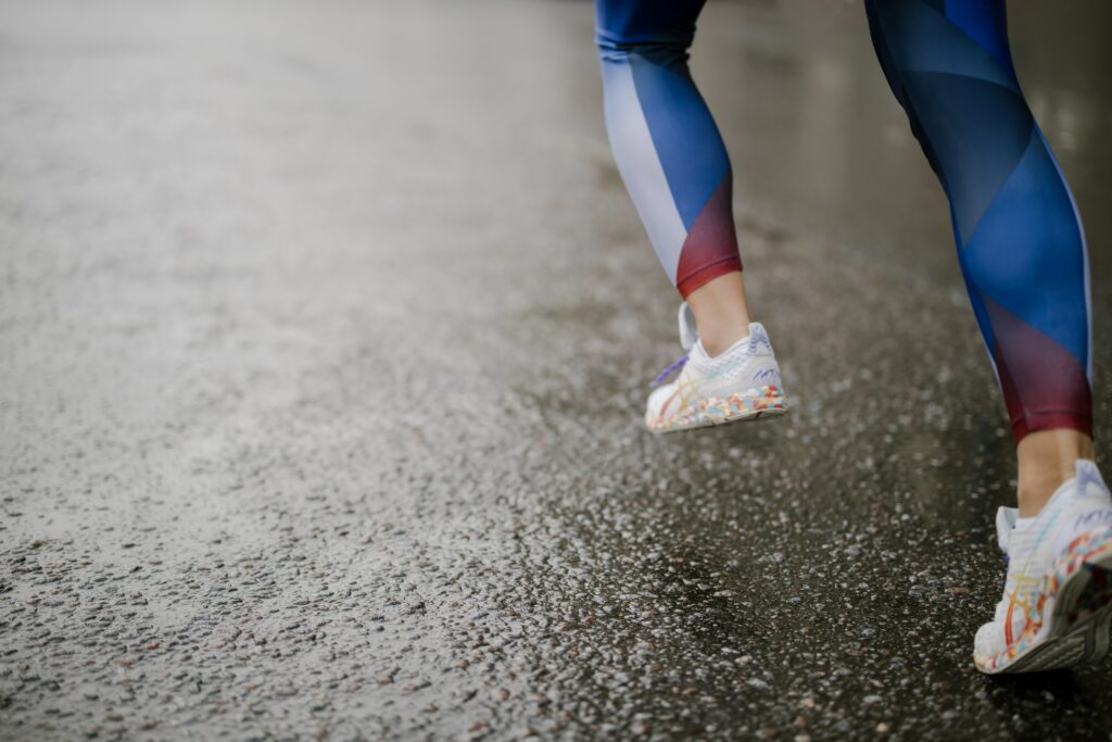 Asics-Glideride-Power-to-Run Forward,-Easier-and-Longer-runner-on-wet-asphalt