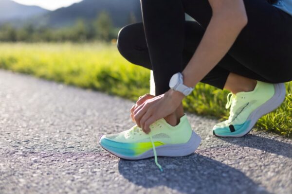 Running shoe guide a woman ties her running shoes