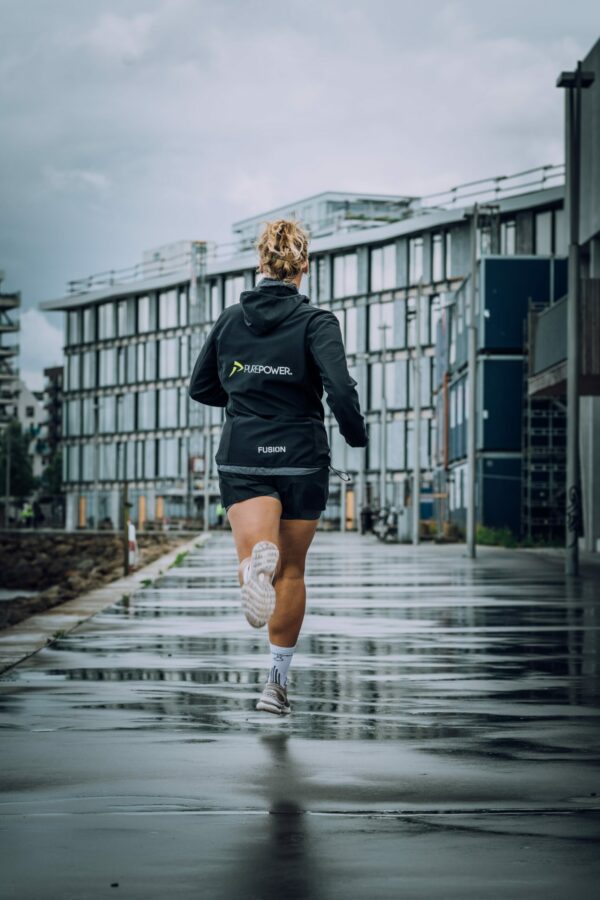 How to Choose The Best Rain Gear For Runners woman running in rain
