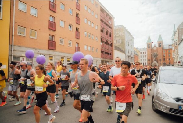 City marathon runners in the small streets of copenhagen marathon
