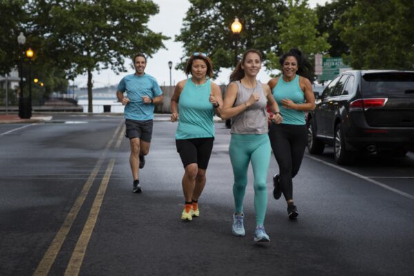running tips for beginners - Beginner-friendly running group finishing a run together