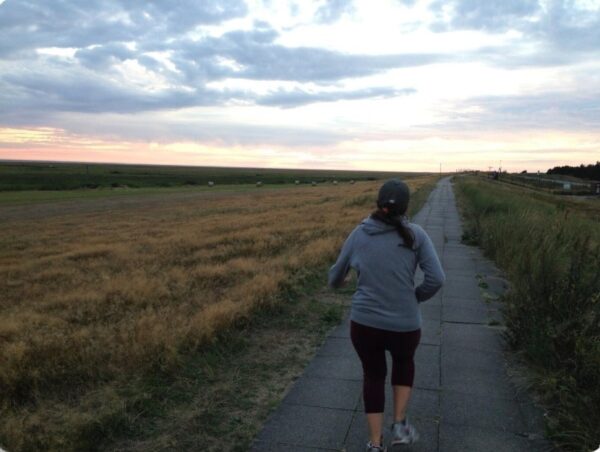 Types of Marathon Training - Distance runner on a long road building endurance