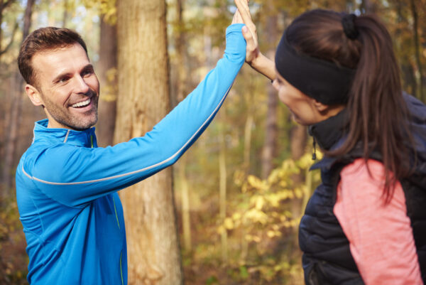 Motivated runner celebrating a training milestone