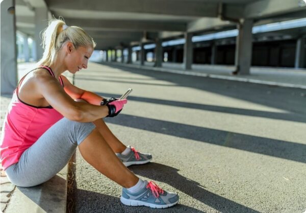 Types of Marathon Training - Runner reviewing a marathon training plan on a mobile with focus
